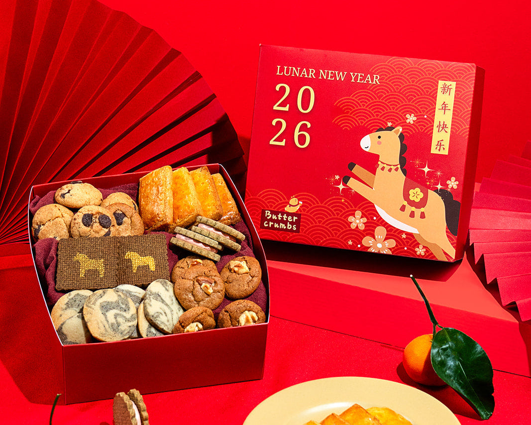 Box of cookies, Lunar New Year calendar, and cookies on a red background
